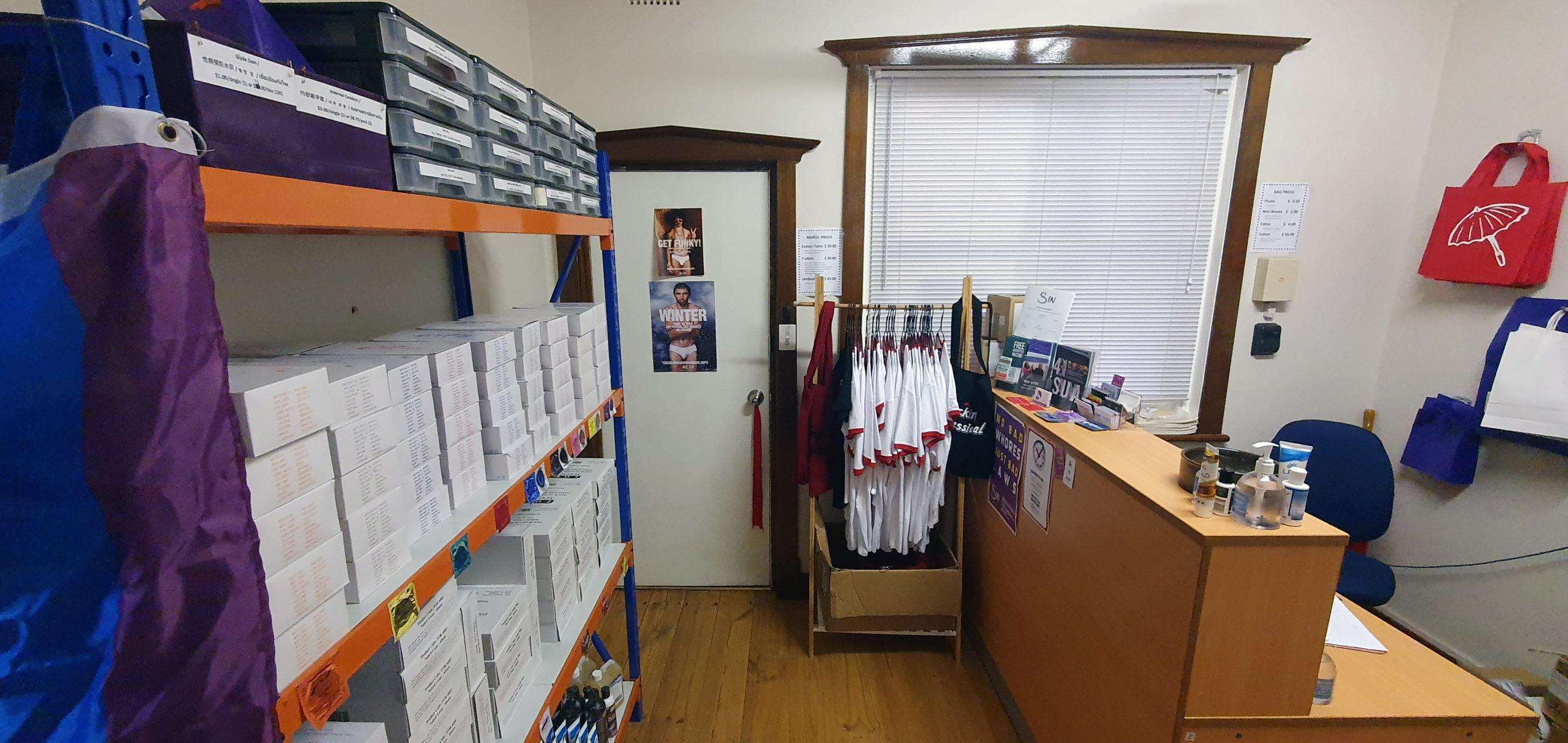 The SIN safer sex shop: a room in the office of the South Australian sex worker peer organisation, stacked with bulk supplies of condoms, lube, and other safer sex supplies.